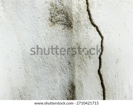 Weathered and peeling wall texture with aged paint, stains, and grunge patterns in earthy tones. Ideal for backgrounds, vintage designs, urban decay themes, and abstract textured surfaces.
