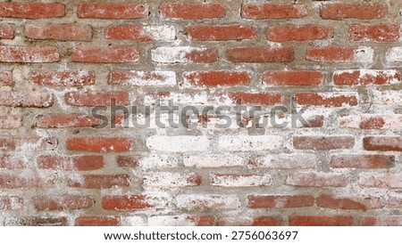 Weathered red brick wall demonstrating a textured vintage background, with visible efflorescence and old masonry detailing, providing a rustic and architectural pattern