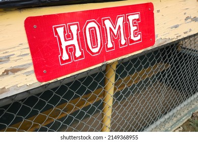 Weathered Red Home Team Sign On Little League Field Dugout