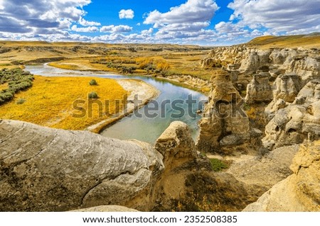 Weathered sandstone rock formations along the Milk River in Writing-On-Stone Provinvial Park, Alberta