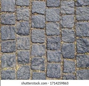 Weathered Stone Sett (Belgian Block) With Dirt And Debris In The Seams, For Texture Or Background