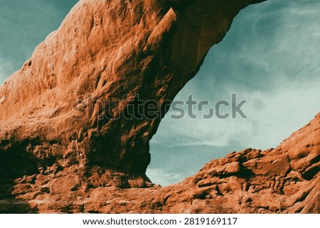 Weathered texture and otherworldly arch support on arid cliff