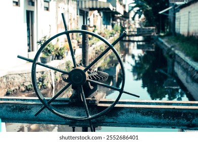 Weathered Vintage Mechanical Wheel on river - Powered by Shutterstock