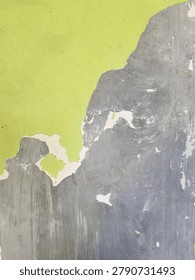 Weathered wall surface with flaking paint in a city parking facility. Detailed texture of deteriorating building materials suitable for urban development, renovation, and infrastructure themes.