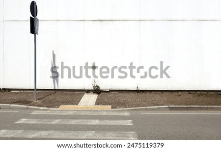 Similar – on patrol Stripe Barrier