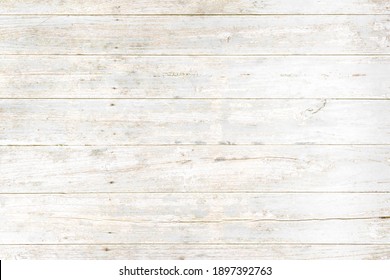 Weathered white painted wooden wall. Vintage white wood plank background. Old white wooden wall.