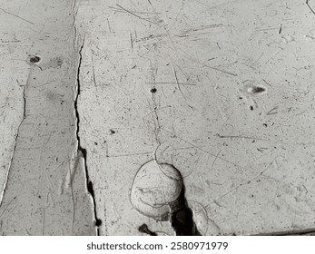 Weathered white wood texture with cracks and scratches shows rustic charm perfect for DIY projects or design backgrounds