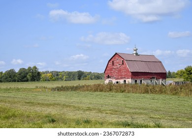 Weathered wood red barn on the farm
