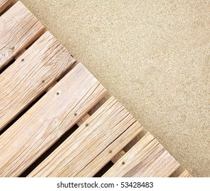 Weathered wooden boardwalk on  sand - Powered by Shutterstock