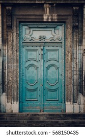Weathered, wooden door in an old church in Lyon, France. With old film effect.