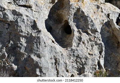 Weathering of limestone: dissolution of carbonate  rock (karstification) .