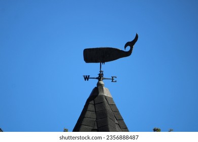 A weathervane in the shape of a whale.