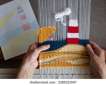 Weaver are making a tapestry with lighthouse following the sketch. Tapestry weaving, selective focus. Hands of artisan at work, close up - Shutterstock ID 2189231947