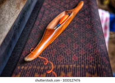 Weaving cloth on fabric. - Shutterstock ID 1033127476