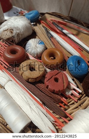 Weaving tools, threads, and handmade spindle whorls for traditional textile crafting