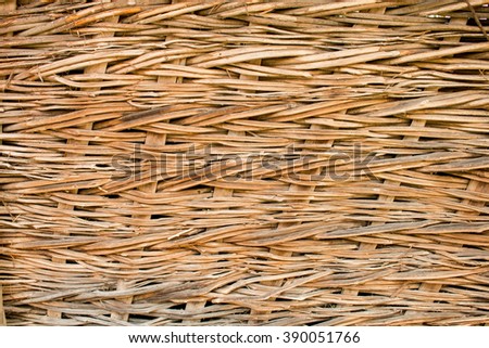 Weaving from twigs. Natural fence. Natural drainage vine. The background is perfect for restaurants, or wallpaper for interiors.