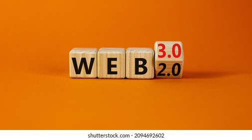 WEB 2 or 3 symbol. Turned a wooden cube and changed words WEB 2.0 to WEB 3.0. Beautiful orange table, orange background, copy space. Business, technology and WEB 2.0 or 3.0 concept. - Shutterstock ID 2094692602
