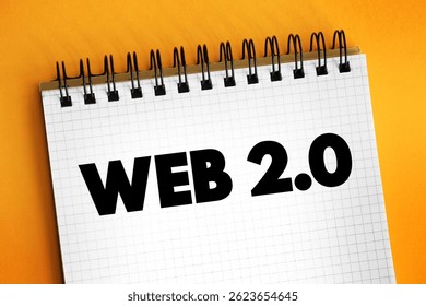 Web 2.0 - websites that emphasize user-generated content, ease of use, participatory culture and interoperability for end users, text concept on notepad