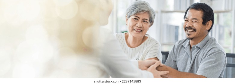 Web banner Asian seniors who are healthy, in a good mood, smiling, talking with financial or life insurance staff to take care of life after retirement. - Powered by Shutterstock