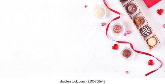 Web Banner With Assorted Chocolate Sweets On The White Table. Valentines Day Dessert. Confectionery Variation. Mockup With Copy Space