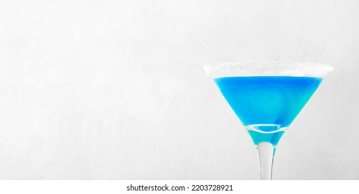 Web Banner With Blue Alcoholic Cocktail Served In Martini Glass Decorated With Sugar Border. Mockup With Copy Space. Minimalism