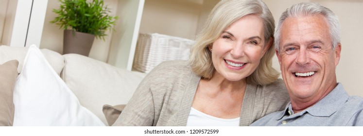 Web Banner Panoramic Image Of Happy Senior Man And Woman Couple Sitting Together At Home Smiling And Happy With Perfect Teeth