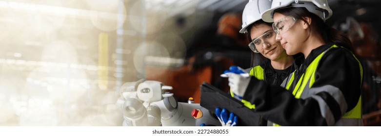 web banner A team of female engineers meeting to inspect computer-controlled steel welding robots. Plan for rehearsals and installation for use. - Powered by Shutterstock