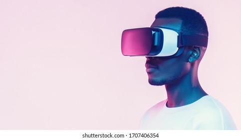 Web banner of young african man wearing virtual reality headset. VR concept. 
