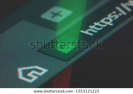 Web browser closeup on LCD screen with shallow focus with light shining through https padlock. Internet security, SSL certificate, cybersecurity, search engine and web browser concepts