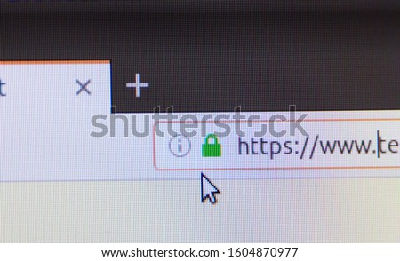 Web browser closeup on LCD screen with shallow focus with light shining through https padlock. Internet security, SSL certificate, cybersecurity, search engine and web browser concepts           