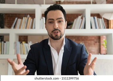 Web cam view of confident middle east appearance businessman having formal conversation talking corporate client look at camera or coach lead online communication make conference video webinar concept - Shutterstock ID 1511399756