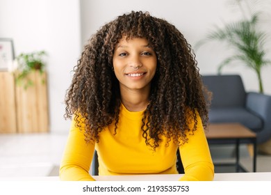 Web Cam View Of Young Adult African American Woman Having A Virtual Video Call At Home Office