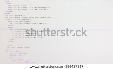 Web coding on developer computer screen.