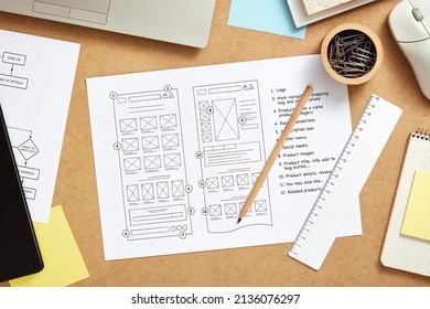 Web design concept. Web designer desk with website wireframe sketches and user flow. Top view