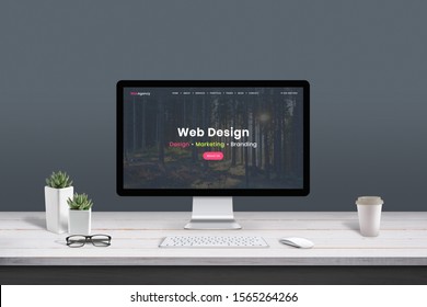 Web Design Studio Concept. Work Desk With Computer Display And Modern Design Web Agency Page.