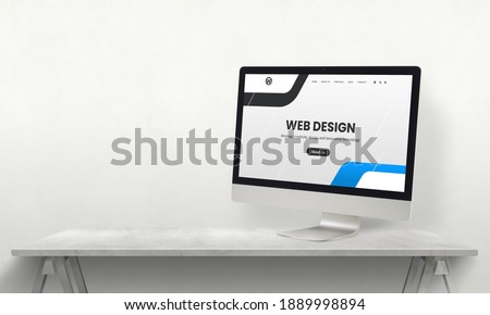 Web design studio desk with computer display and promo web page on it. Development team promotion concept