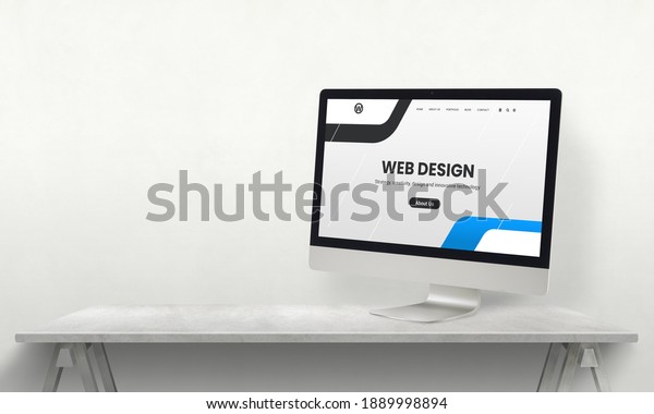 Web design studio desk\
with computer display and promo web page on it. Development team\
promotion concept