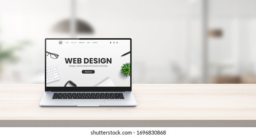 Web Design Studio Promo Web Site On Laptop Display On Office Desk Concept