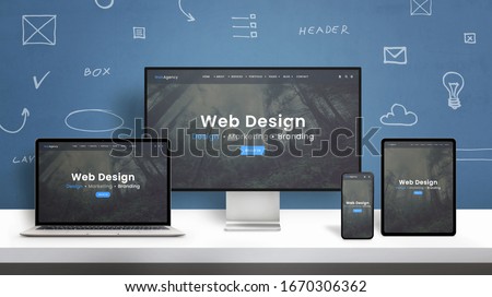 Web design studio web site responsive design presentation on computer display, laptop, smart phone and tablet. Blue wall with web design concept elements
