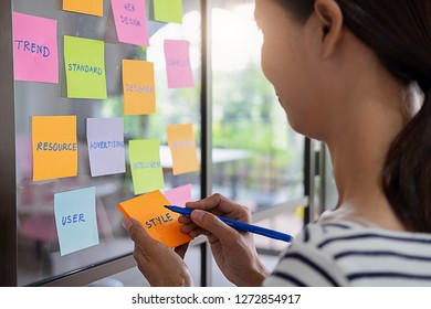 Web designer brainstorming for a strategy plan. Colorful sticky notes with things to do on office board. User experience (UX) concept. - Shutterstock ID 1272854917