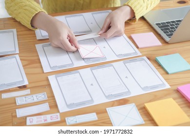 Web designer planning application for mobile phone. Design application development draft sketch drawing online Technology Content.User experience concept.