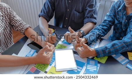 web designers are working together to develop mobile responsive website with UI  UX Front End Designer Previewing. Programmers designers in form of mobile applications with UI  UX Designer