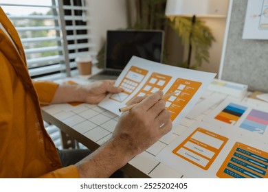 A web developer, as a User Experience and User Interface Officer, is designing beautiful and easy-to-use digital products that create a positive emotional and visual experience for users.