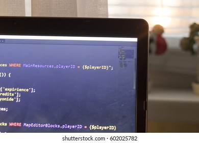 Web development PHP code close up. Abstract information digital technology modern background. Running SQL database queries. Screen corner of web developer.