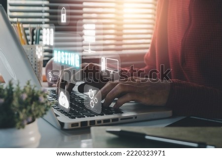Web hosting concept, Man using computer and presses his finger on the virtual screen inscription Hosting on desk, Internet, business, Technology and network concept. 