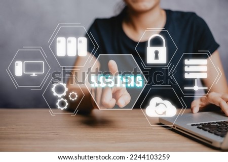 Web hosting concept, Woan using computer and presses his finger on the virtual screen inscription Hosting on desk, Internet, business, Technology and network concept.