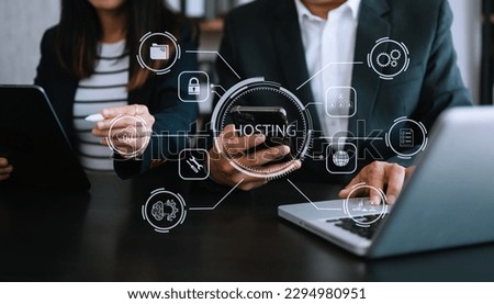 Web hosting concept, woman using computer, tablet and presses his finger on the virtual screen inscription Hosting on desk, Internet, business, digital technology concept. in office

