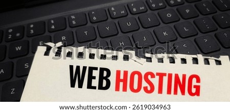 Web Hosting text printed on a piece of paper placed on computer keyboard, internet server concept, domain hosting service, website management and technology. 