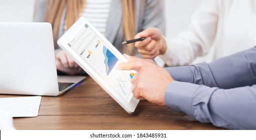 Web Marketing Managers With Gadgets Working On Paid Search And SEO Strategies, Closeup Of Hands. SMM Spesialists Planning Brand Promotion Budget, Raising Company Awareness In Social Media