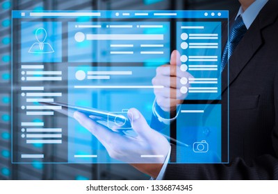 Web page browser of Social media Page VR Interface on the laptop computer.businessman hand using tablet computer and server room background - Shutterstock ID 1336874345